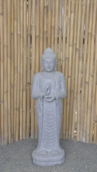 Product image of the product “Standing Buddha made of Riverstone in Dharmachakra position - gesture of wheel of the teaching of Dharma. About 122cm height. ”